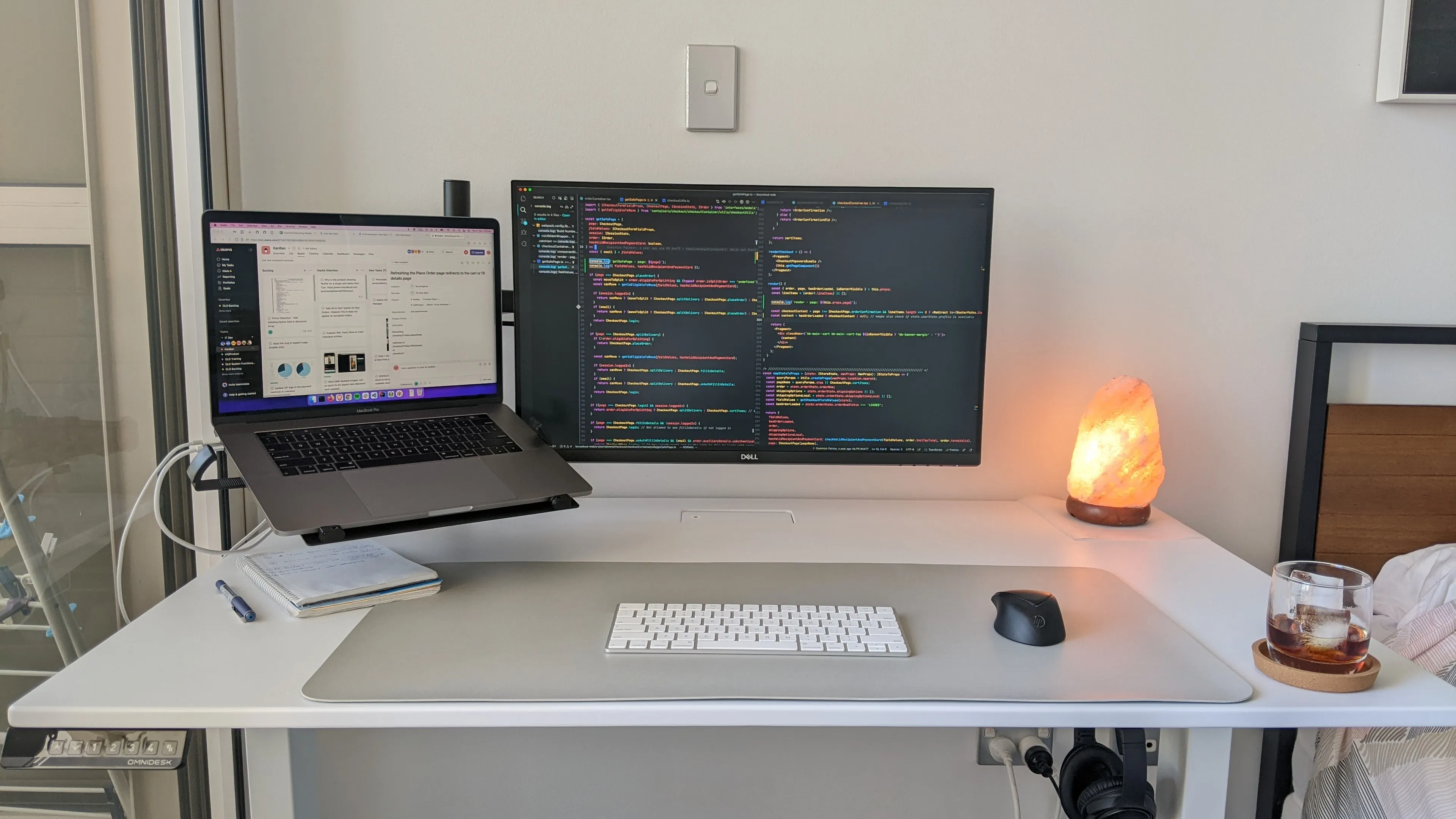 A working desktop with monitors, keyboard and a mouse.