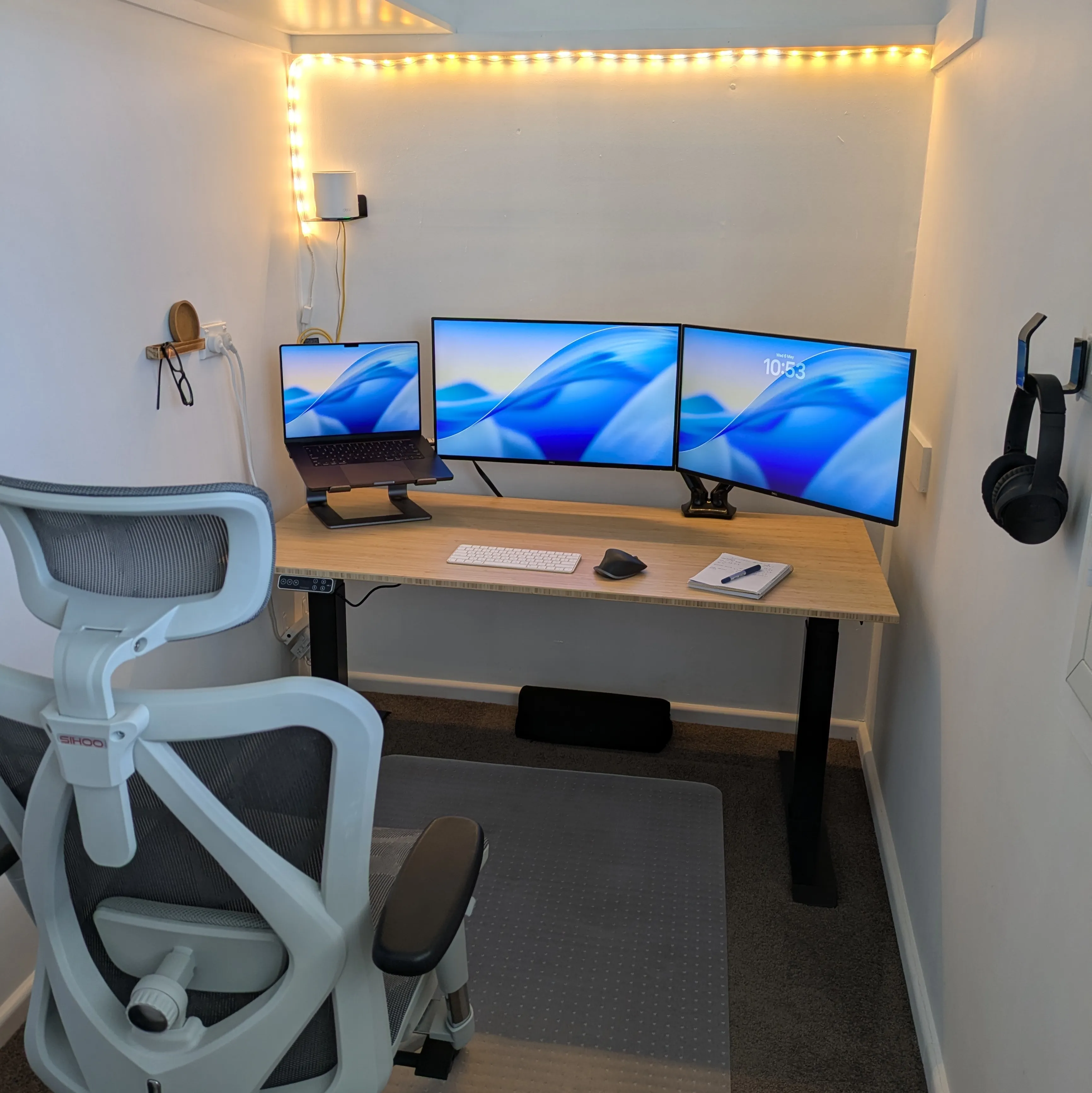 A working desktop with monitors, keyboard and a mouse.